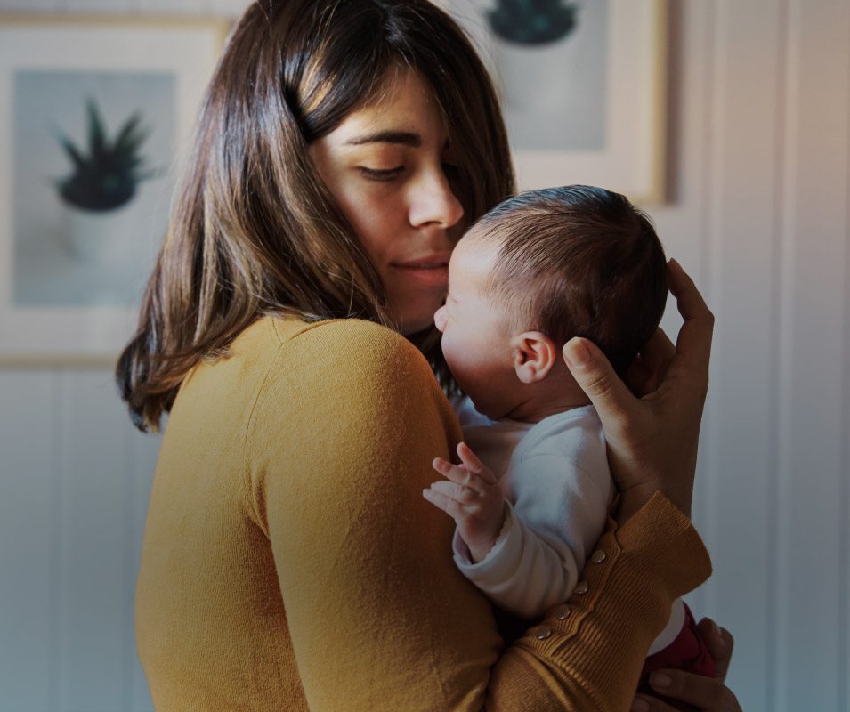 MOTHER HOLDING BABY