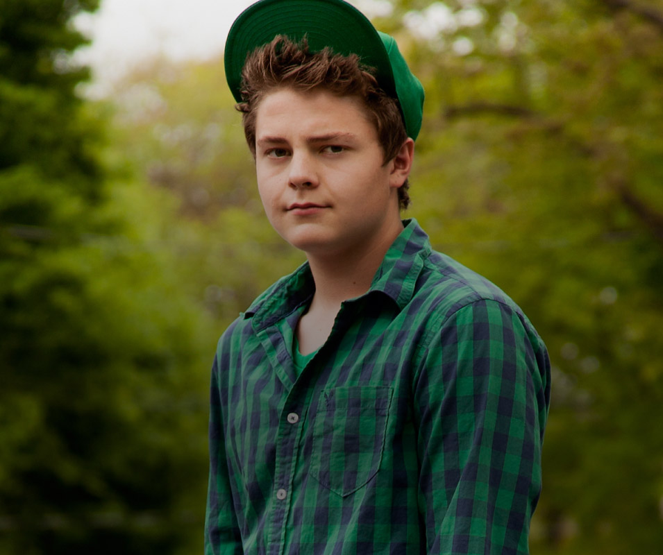 YOUNG MAN STANDING OUTSIDE