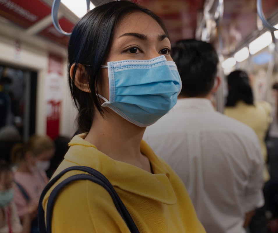 WOMAN WEARING HOSPITAL MASK ON THE SUBWAY