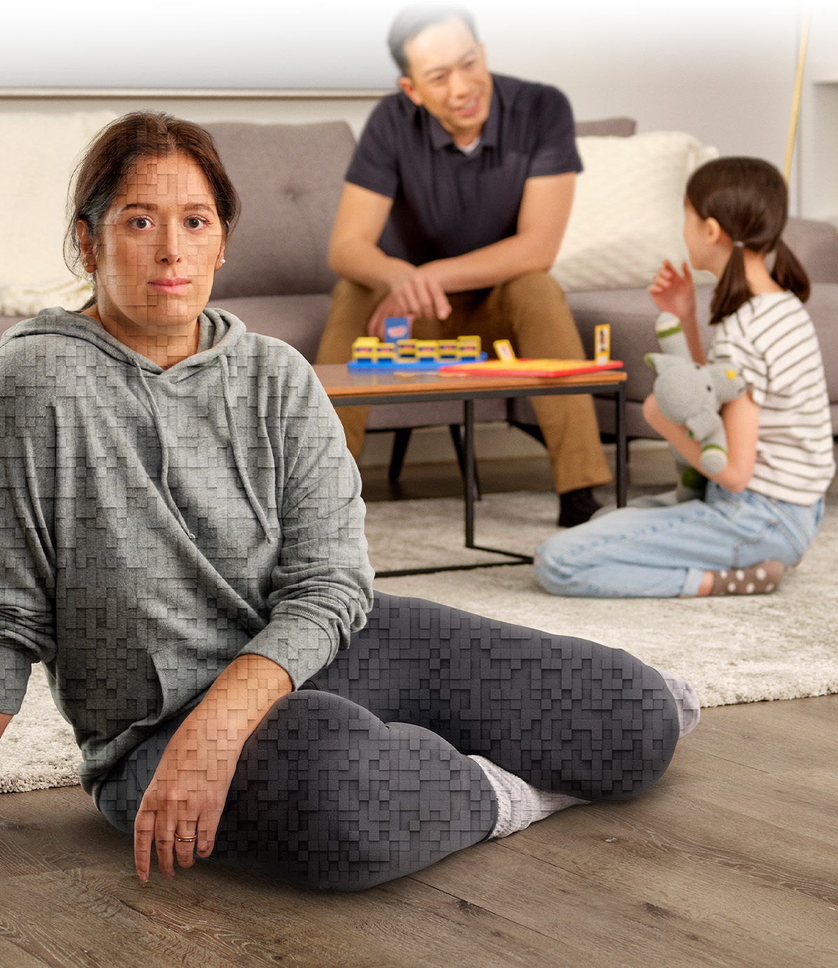 A woman sitting on the floor of her living room with her family with the caption, 'Ask your doctor about Trintellix.'