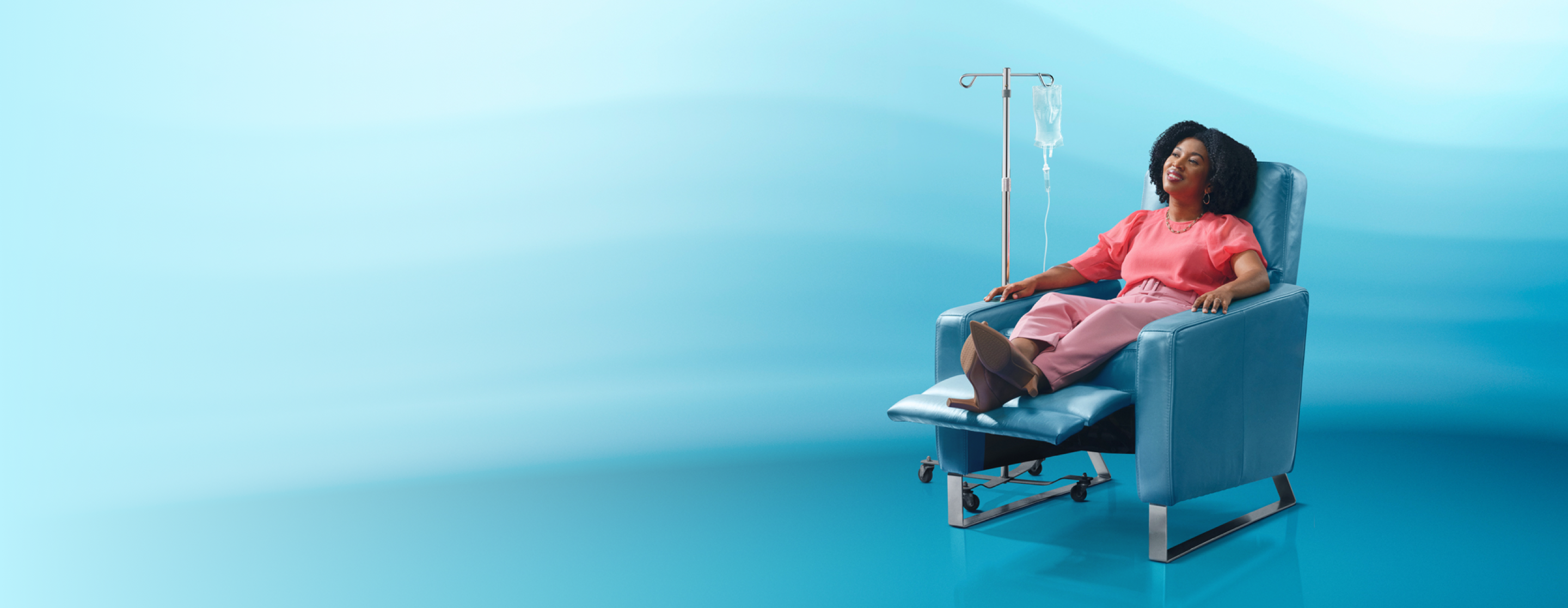 Female VYEPTI® patient sitting in reclined chair.